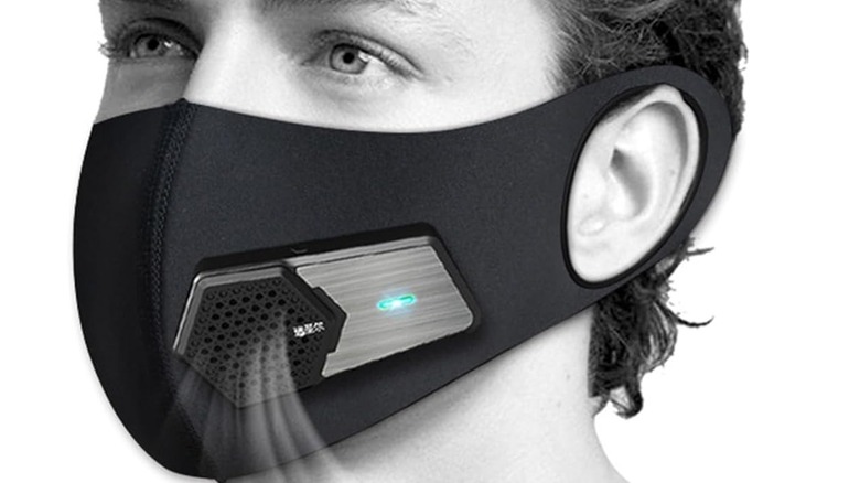 A face mask that is purifying the air as the person breathes in.