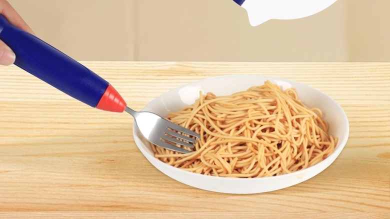 A fork being put into spaghetti.