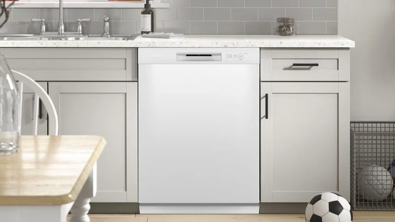 Hotpoint HDF330PGRWW dishwasher in kitchen setting