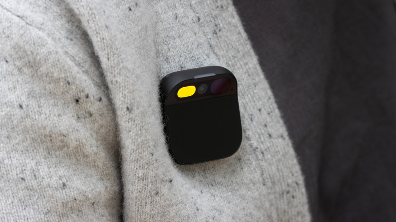 A person wearing the Humane AI Pin on their sweater
