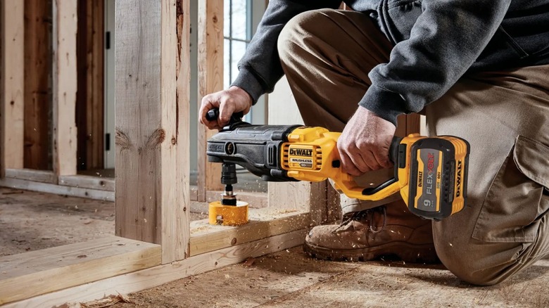 Man using DeWalt DCD471B Stud and Joist Drill