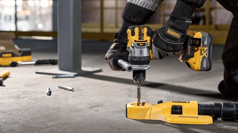 Man holding DeWalt DCD1007B Hammer Drill