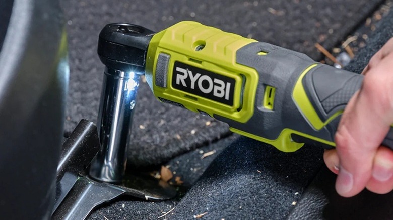 Person using Ryobi 3/8-inch ratchet