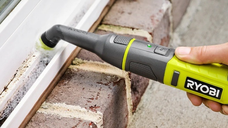 Detail scrubber cleaning window frame