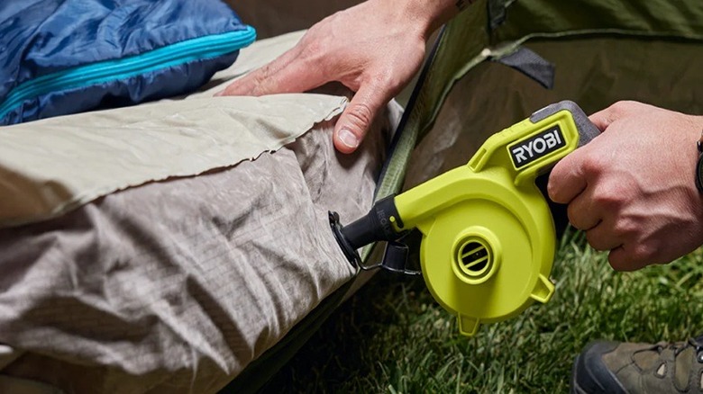 Person using high volume inflator