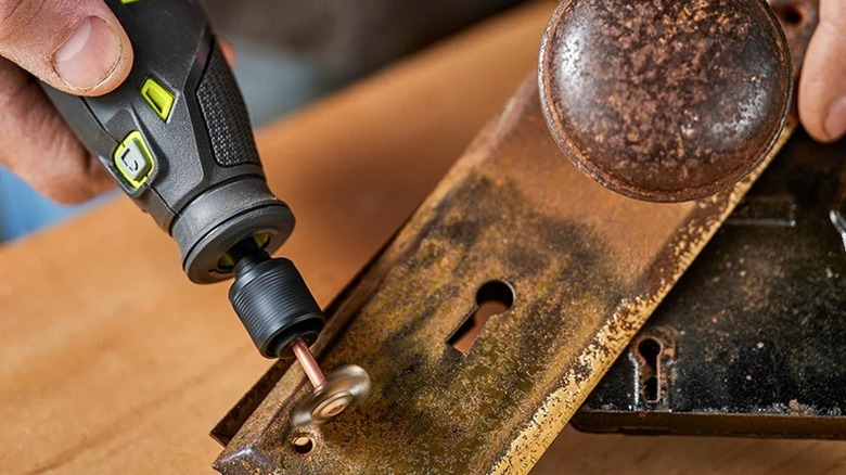 Person using Ryobi rotary tool