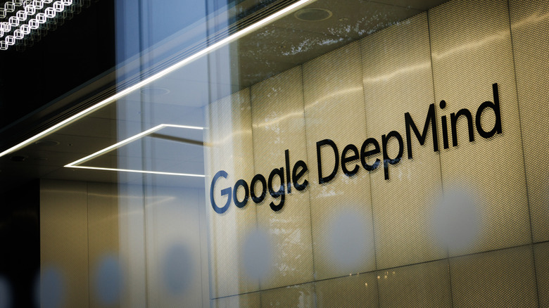 A Google DeepMind logo on a window in a building.