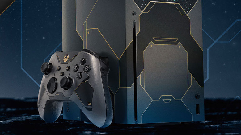 A limited edition Halo Infinite Xbox Series X console and controller with gold accents.