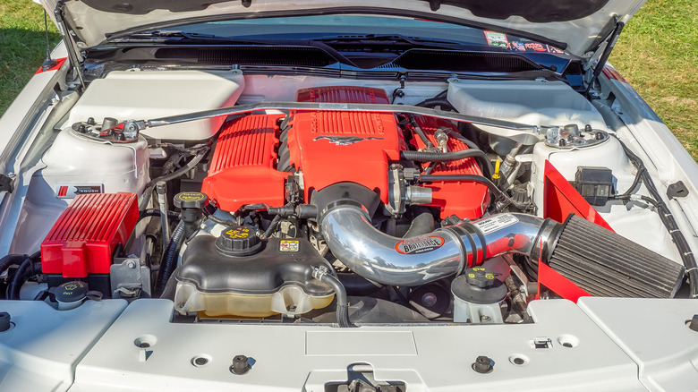 A car engine with the hood popped