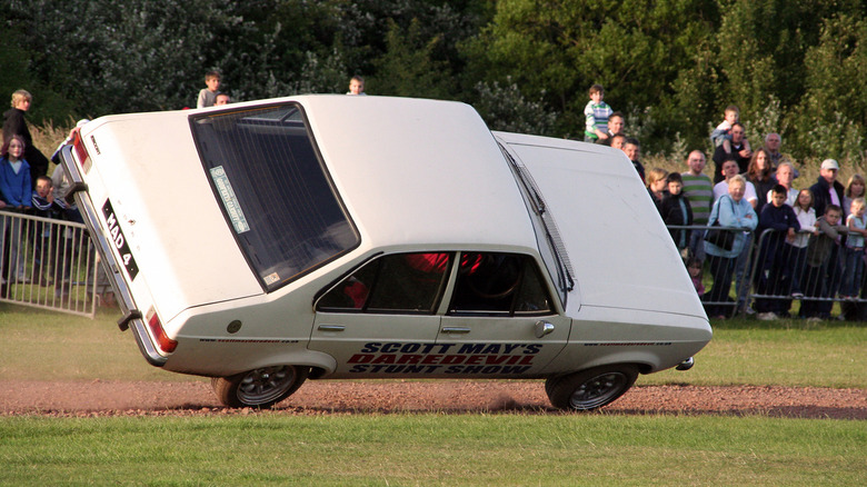 A car up on two wheels