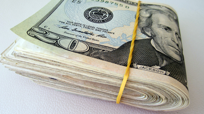 A wad of cash held together by a rubber band