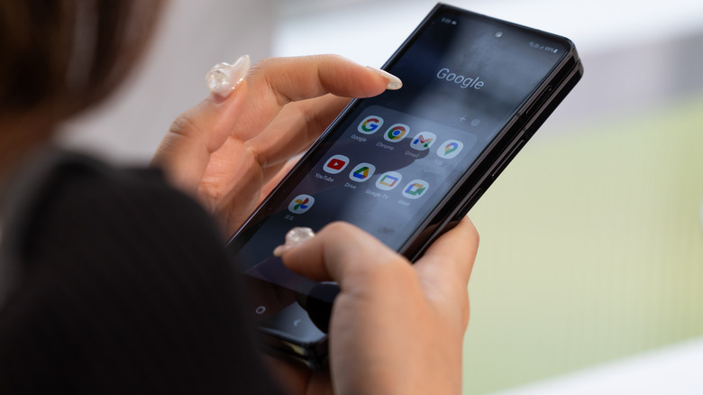 woman uses Galaxy Z Fold 5 at Samsung event in Seoul