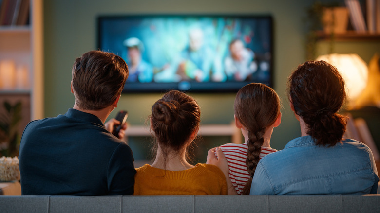 A group of people watching TV