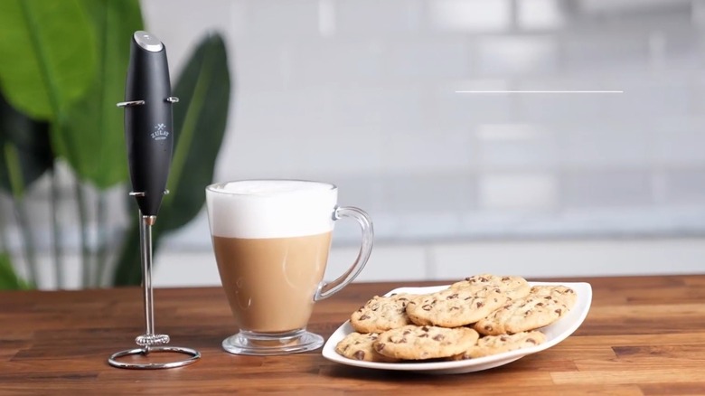 Milk frother with coffee and cookies