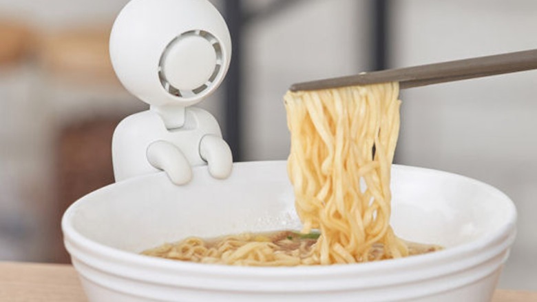 A Life on Cup and Bowl Cooling Fan cooling ramen in a bowl