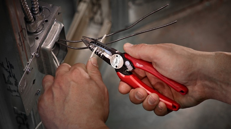 Professional using Milwaukee 6-in-1 wire stripper/cutter