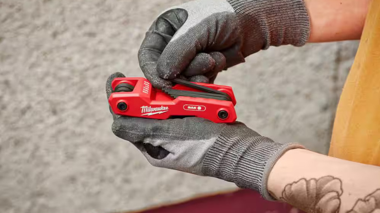 Worker using Milwaukee hex keys