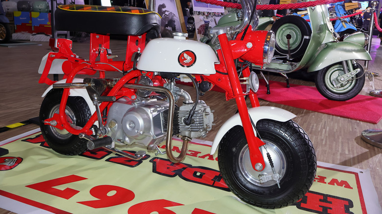 A red and white classic Honda Monkey motorbike, sold in America as the Z50A.