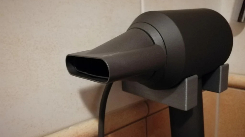 Dyson hair dryer on a 3D printed rack