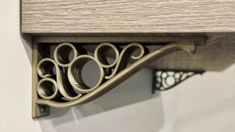 3D printed shelf bracket holding up a shelf