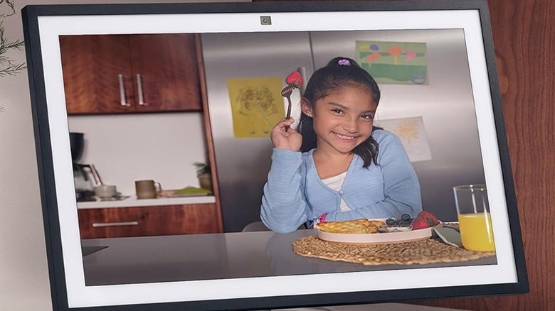 An Amazon Echo Show 21 acts as a digital photo frame in a kitchen setting.