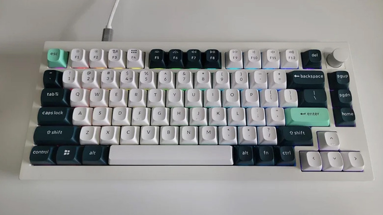 A tenkeyless Keychron Q1 HE on a white desk