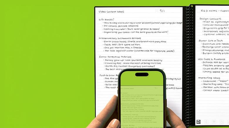 A person scanning their Rocketbook with their smartphone.