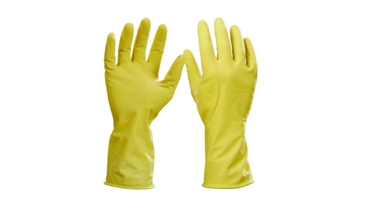 Pair of yellow latex cleaning gloves