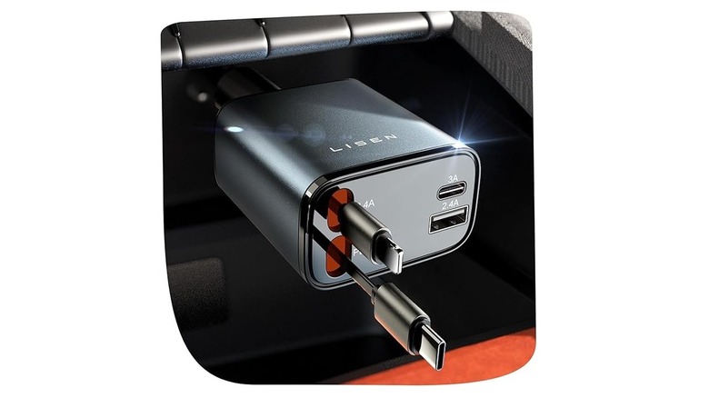 12 volt charger plugged into car with a white background