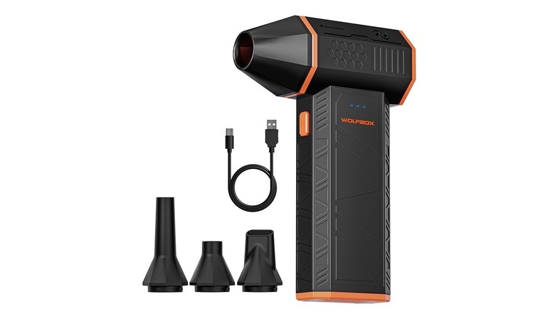 Compressed air duster with accessories on white background