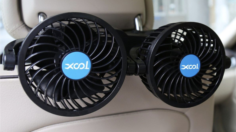 Car fans mounted to the back of a headrest