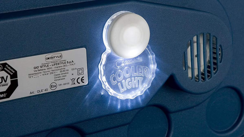 Coghlan's cooler light attached to the inside of a cooler with the LED light on