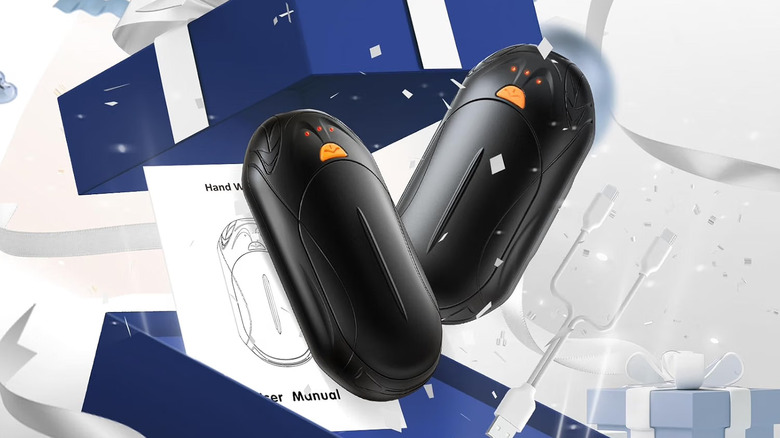 A pair of Unihand rechargeable handwarmers being removed from a box