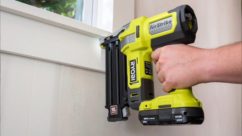 A Ryobi brad nailer used to install a window.