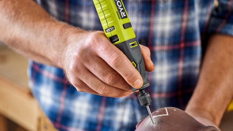 carving design into pottery with Ryobi rotary tool