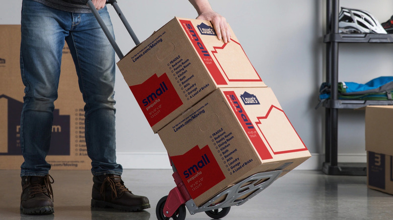 Person using Milwaukee hand truck
