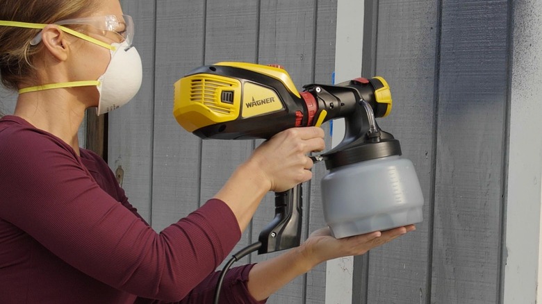Person using Wagner paint sprayer