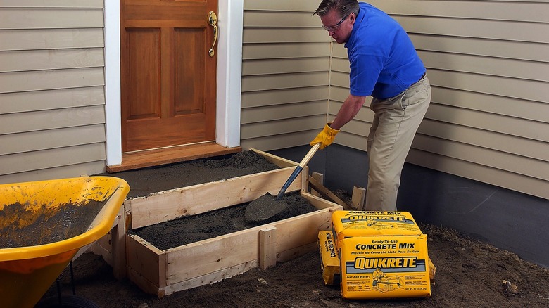 Person using Quikrete to make stairs