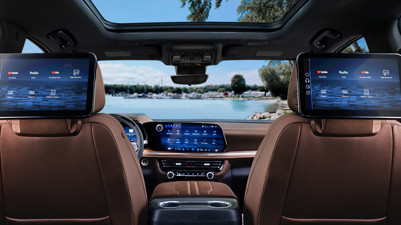 The interior of the 2026 Chevrolet Suburban from the second row of seats, showcasing the rear infotainment screens