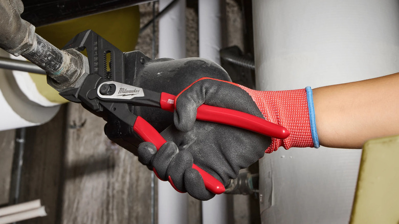 Worker using a Milwaukee 5-inch Pliers Wrench