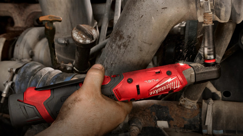Mechanic using a Milwaukee M12 Fuel 3/8-inch Ratchet