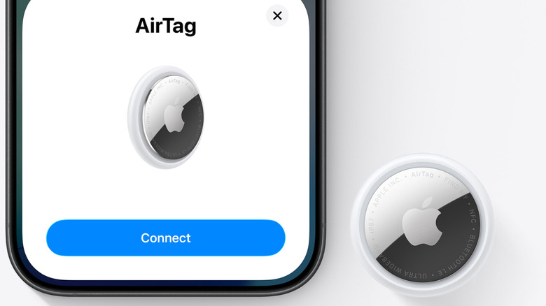 AirTag pairing with an iPhone over white background