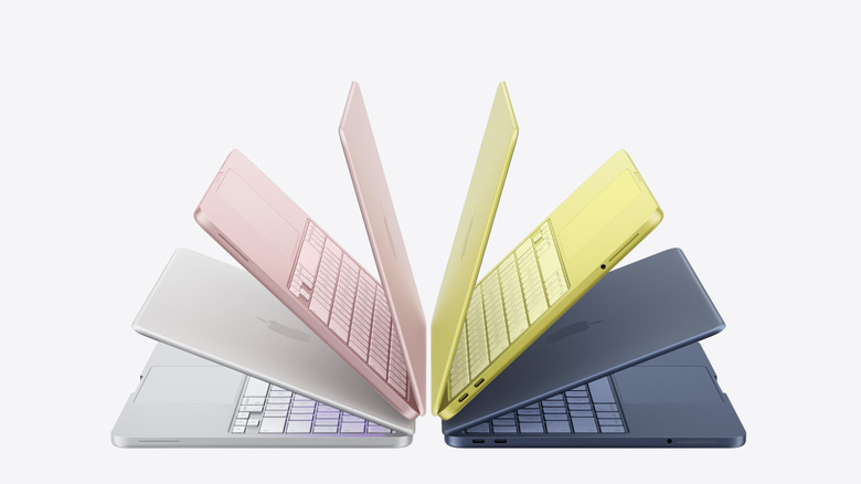 multiple MacBook Neos opened partially in a fan pattern over a white background