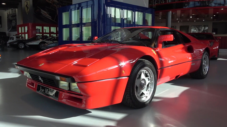 A red Ferrari 288 GTO in a showroom