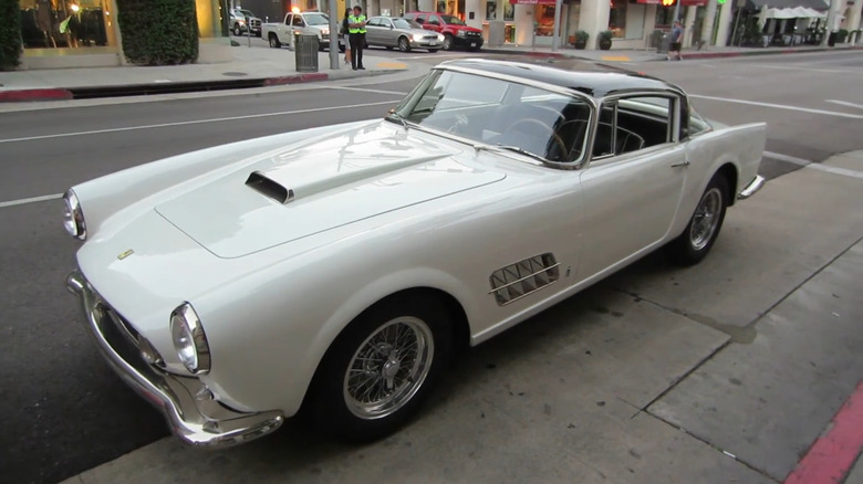 A white Ferrari 410 Superamerica parked