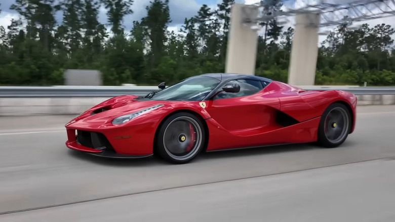 A red Ferrari LaFerrari driving
