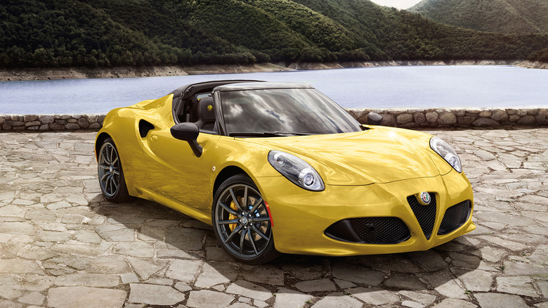 A side on shot of a yellow 2018 Alfa Romeo 4C parked