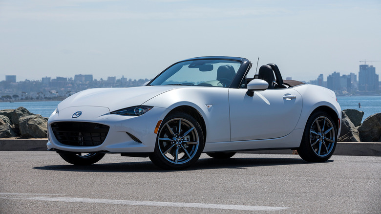 A side on shot of a white 2023 Mazda MX-5 parked