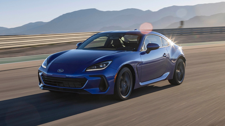 A side on shot of a blue 2023 Subaru BRZ driving