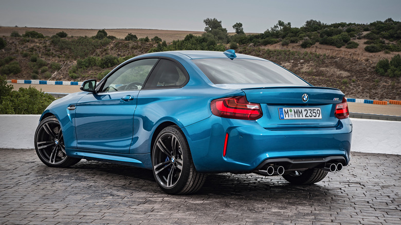 A rear view shot of a blue 2016 BMW M2